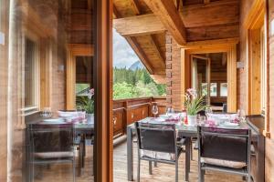 a dining room with a table and chairs and a window at Mountainlodge in Leutasch