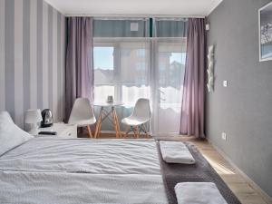 Oaza Leba - Idealny dla rodzin z dziecmi客房内的一张或多张床位