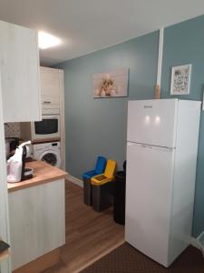 Kuchyň nebo kuchyňský kout v ubytování Appartement AB DU PARC
