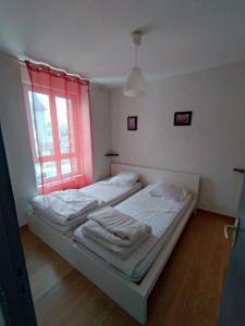 מיטה או מיטות בחדר ב-appartement vue mer