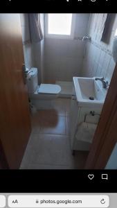 a bathroom with a toilet and a sink at Spanish Villa in Torre del Rame