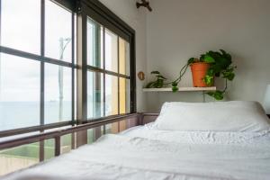 Cama ou camas em um quarto em Casanaga