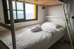 Cama ou camas em um quarto em Casanaga
