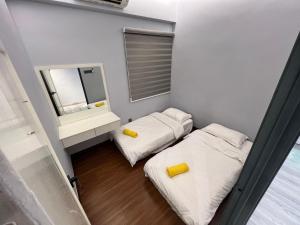 Postel nebo postele na pokoji v ubytování Sri Indah Condominium Sandakan + 2 fotografie