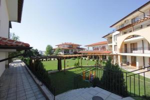 a view of a courtyard of a building with a playground at Arkite - Private apartment - BSR in Sunny Beach