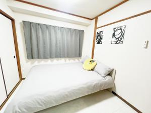 Postel nebo postele na pokoji v ubytování 池袋駅電車4分最大6人 02
