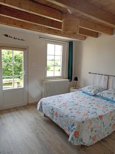 Postel nebo postele na pokoji v ubytování Chambre d'hôtes La Tuilerie
