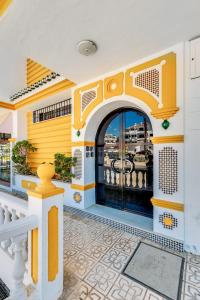 an entry to a building with a large door at Seaflower Torrox Costa in Torrox Costa