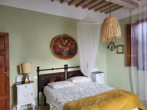 Postel nebo postele na pokoji v ubytování Casa Fleurdelys Toscana
