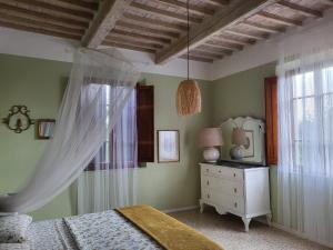 Postel nebo postele na pokoji v ubytování Casa Fleurdelys Toscana