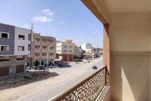 a view of a city street from a balcony at Logement familial 3 in Selouane