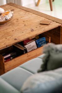 a wooden coffee table with books on it at Piscadera Harbour Village in Willemstad