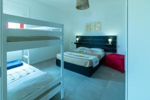 A bed or beds in a room at Appartamenti Craulo