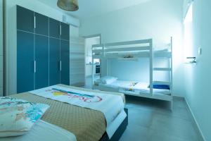 A bed or beds in a room at Appartamenti Craulo