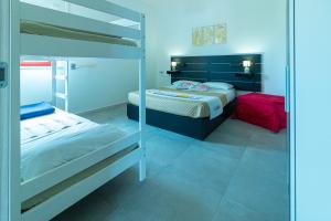 A bed or beds in a room at Appartamenti Craulo