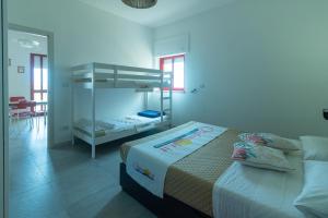 A bed or beds in a room at Appartamenti Craulo