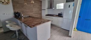 a kitchen with a sink and a counter top at Mojácar Vibes 1 Línea de Playa in Mojácar