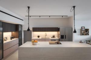 a kitchen with a bowl of fruit on a counter at Casa Amalia in Aghia Marina