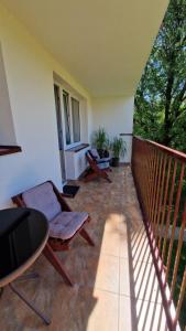 Balkón alebo terasa v ubytovaní Apartament na Błoniach