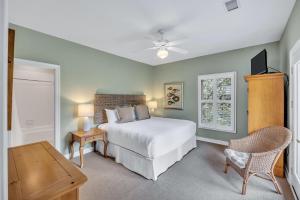 a bedroom with a bed and a desk and a window at SM07: 7 Silver Moss in Kiawah Island +54 photos