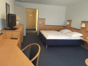 Postel nebo postele na pokoji v ubytování Hotel Görres