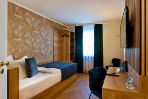 Postel nebo postele na pokoji v ubytování Atrium Hotel Amadeus