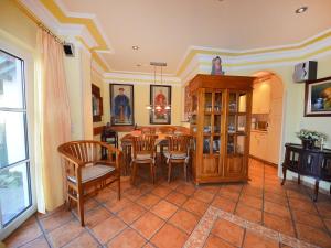 a dining room with a table and chairs at Holiday Home Kirchhaus by Interhome in Groß Zicker