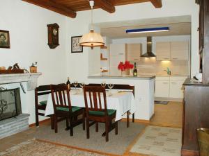 a kitchen and dining room with a table and chairs at Apartment Casa Strecce - App- 2 by Interhome in Crana
