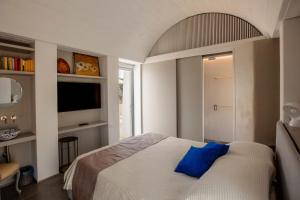 Voodi või voodid majutusasutuse Il Trullino toas