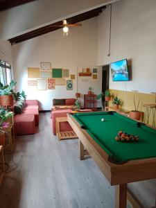 a living room with a pool table in a room at La Seventy Nomad Mood in Medellín
