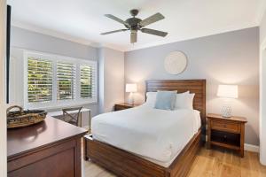 a bedroom with a bed and a ceiling fan at 4976 Turtle Point in Kiawah Island