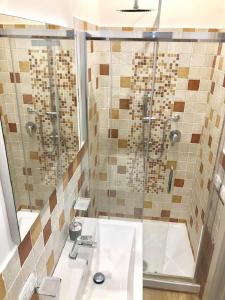 a bathroom with a shower and a sink at B&b A Due Passi Dal Sole in Porto Empedocle +39 photos