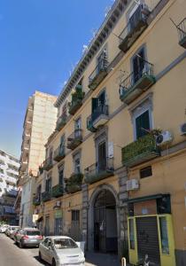 a tall building with cars parked in front of it at Vista sull'Eremo in Naples