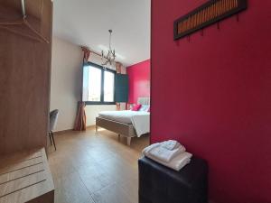 A bed or beds in a room at B&B Domu Mea