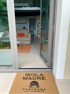 a door with a sign that reads isola madrearma at Panorama Loft Apartments in Stresa