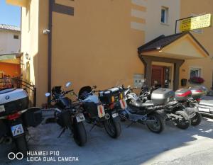 a row of motorcycles parked outside of a building at Villa Ohrid Anastasia in Ohrid