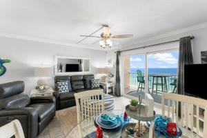 a living room with a couch and a table at The Summit 1130 in Panama City Beach