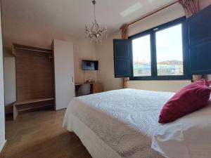 A bed or beds in a room at B&B Domu Mea