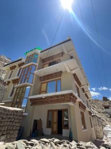 a house on the side of a mountain at De katong in Leh