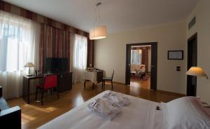 Letto o letti in una camera di Hotel Guglielmo
