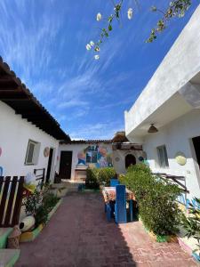 a courtyard of a house with a blue sky at Dahab Days Hostel in Dahab