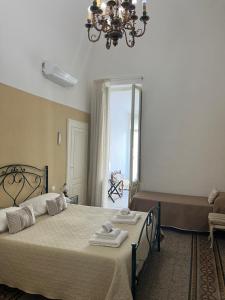 Postel nebo postele na pokoji v ubytování B&B Chimera Bari