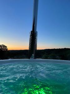 a view of a building in the water at Ecosse Glamping in Crossford +20 photos