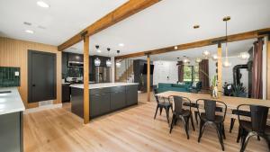 a kitchen and dining room with a table and chairs at Tranquil Country Escape 4 Bedrooms Pond Firepit in Greenville