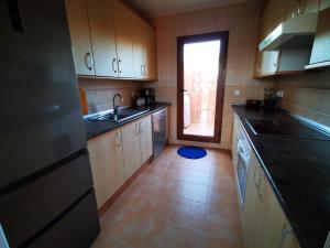 A kitchen or kitchenette at Attic apartment in Vera Beach with wifi and air-conditioning