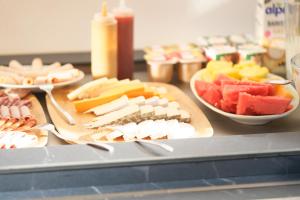 a table with different types of cheese and fruit at La Garoupe-Gardiole in Antibes