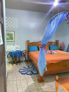 Кровать или кровати в номере Cabinas Mitchaelle's