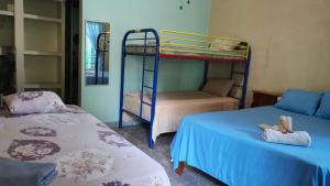 Кровать или кровати в номере Cabinas Mitchaelle's