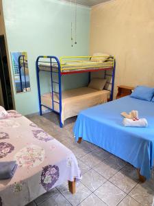 Кровать или кровати в номере Cabinas Mitchaelle's