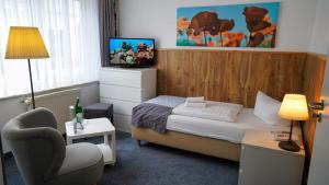 Postel nebo postele na pokoji v ubytování Hotel & Restaurant Seebrücke